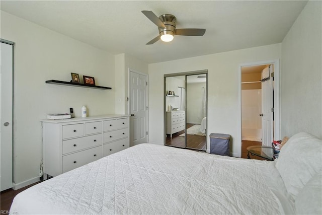 bedroom with dark wood-style floors, ensuite bathroom, a ceiling fan, and a closet