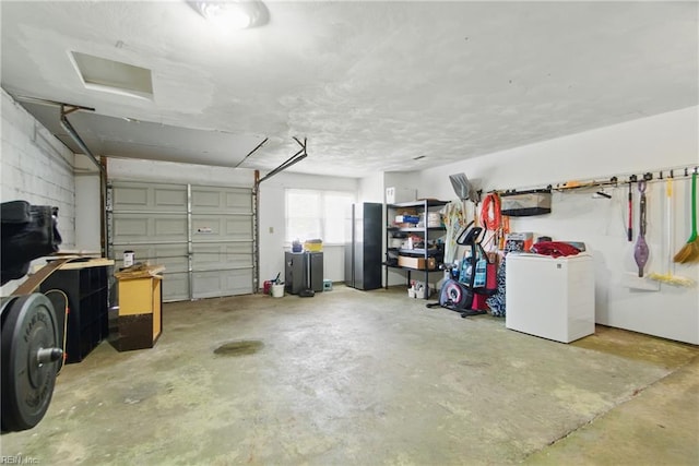 garage featuring refrigerator and freestanding refrigerator