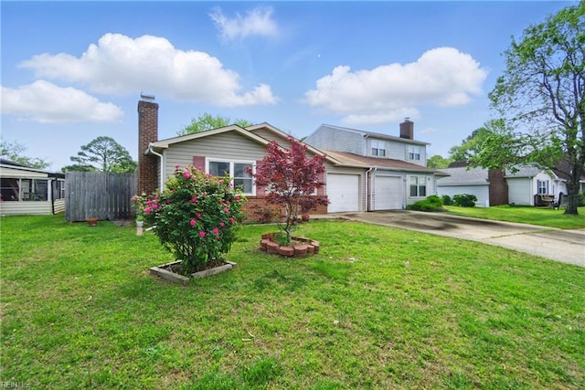 view of front of property with a chimney, brick siding, fence, driveway, and an attached garage
