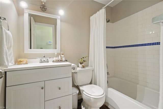 full bath featuring shower / bath combo with shower curtain, toilet, and vanity