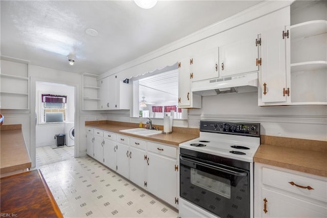 kitchen with open shelves, under cabinet range hood, range with electric cooktop, and a sink