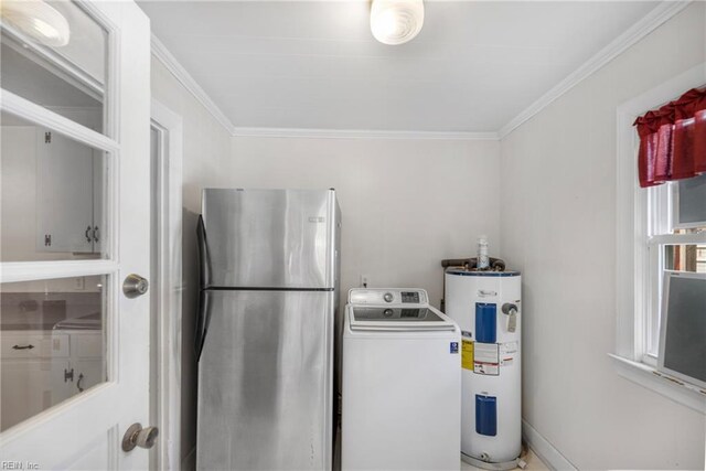 clothes washing area with electric water heater, ornamental molding, laundry area, and washer / clothes dryer