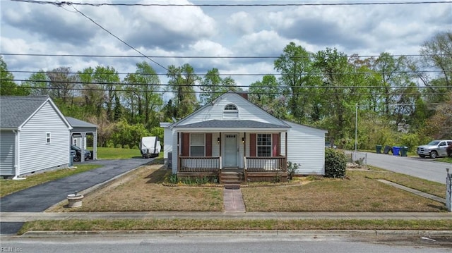 view of front of house with a porch and a front yard