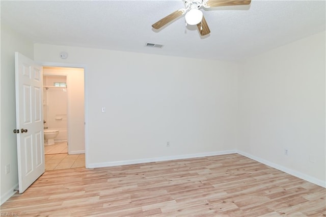 empty room with light wood-style flooring, baseboards, and ceiling fan