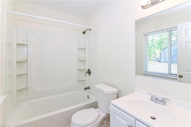 full bathroom featuring toilet, vanity, and  shower combination