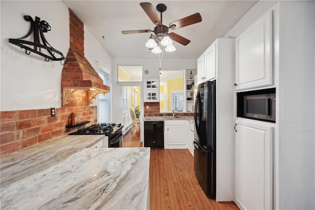 3716 Colonial Ave, Norfolk, VA 23508 - kitchen featuring black appliances, open shelves, ceiling fan, white cabinets, and light wood finished floors