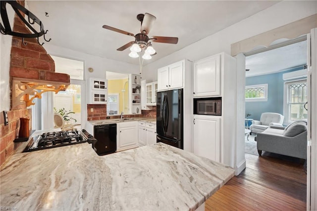 3716 Colonial Ave, Norfolk, VA 23508 - kitchen with black appliances, a ceiling fan, a peninsula, glass insert cabinets, and white cabinetry