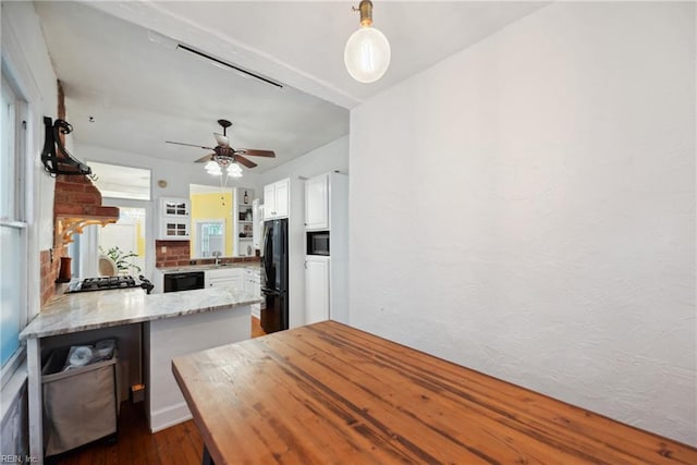 3716 Colonial Ave, Norfolk, VA 23508 - kitchen featuring black appliances, a peninsula, open shelves, white cabinetry, and dark wood finished floors