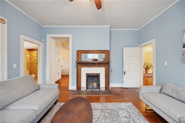 3716 Colonial Ave, Norfolk, VA 23508 - living room with ceiling fan, wood finished floors, crown molding, a fireplace with flush hearth, and a wall unit AC
