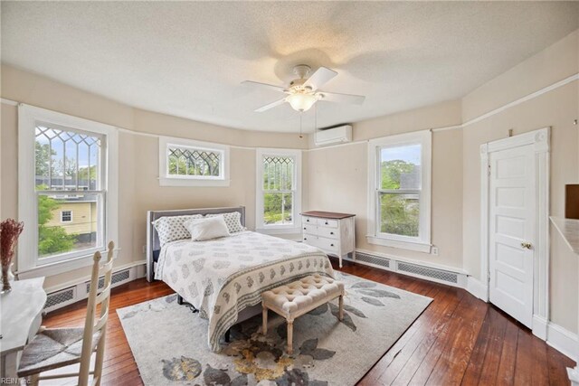 3716 Colonial Ave, Norfolk, VA 23508 - bedroom with a wall mounted AC, hardwood / wood-style flooring, multiple windows, and baseboards