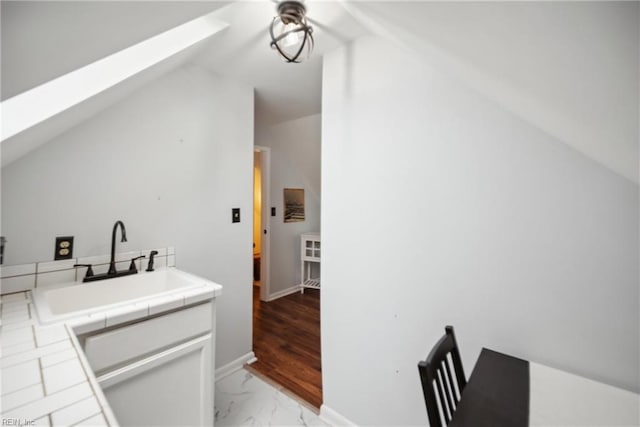 3716 Colonial Ave, Norfolk, VA 23508 - bar with a skylight, vaulted ceiling, a sink, light marble finish floors, and a ceiling fan