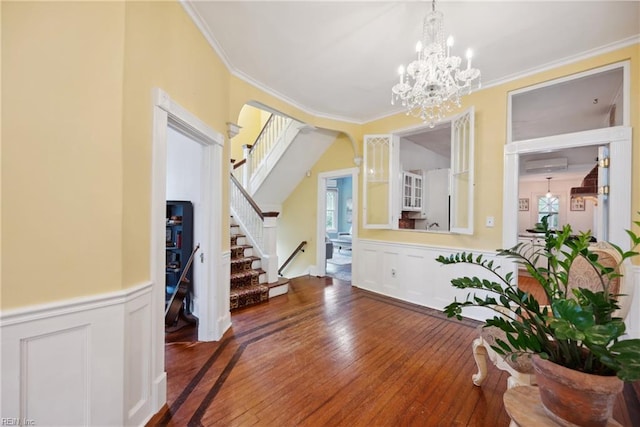 3716 Colonial Ave, Norfolk, VA 23508 - foyer entrance featuring stairway, ornamental molding, wood-type flooring, wainscoting, and a decorative wall