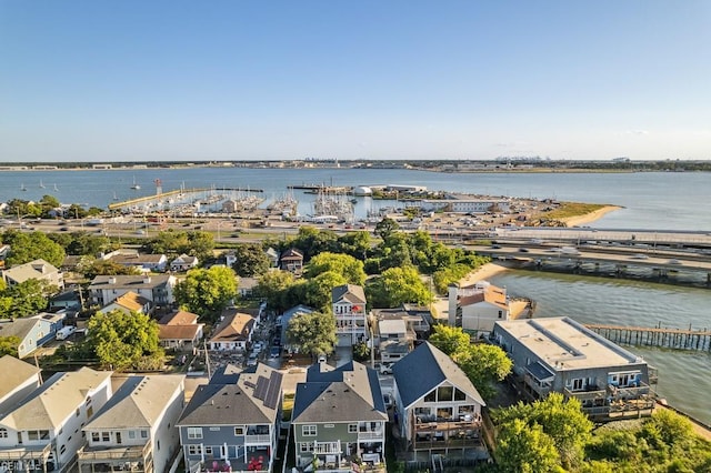 drone / aerial view with a water view and a residential view