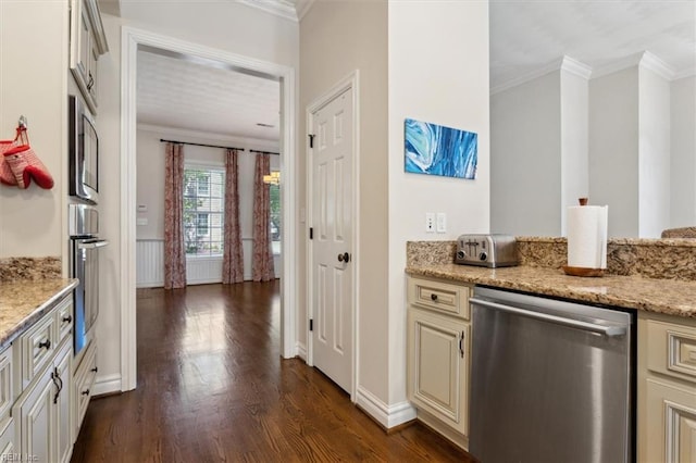 kitchen featuring stainless steel dishwasher, dark wood-style flooring, crown molding, light stone countertops, and cream cabinets