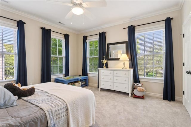 bedroom featuring a ceiling fan, light carpet, ornamental molding, and baseboards