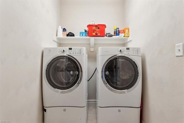 laundry area featuring independent washer and dryer and laundry area