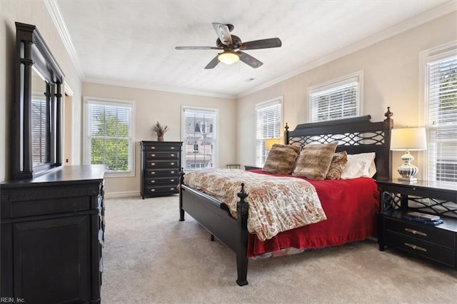 bedroom with ceiling fan, light carpet, ornamental molding, and baseboards