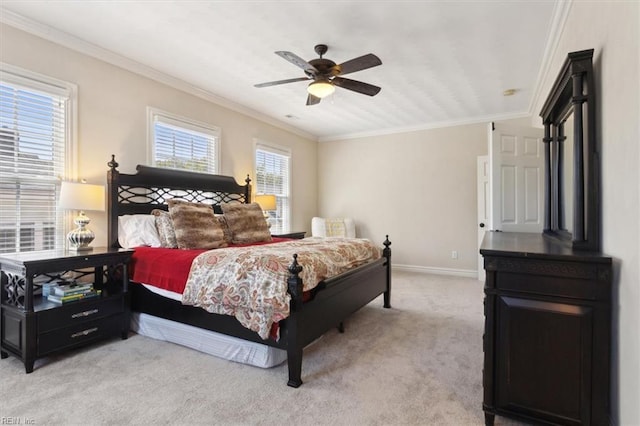 bedroom with light carpet, ornamental molding, and multiple windows