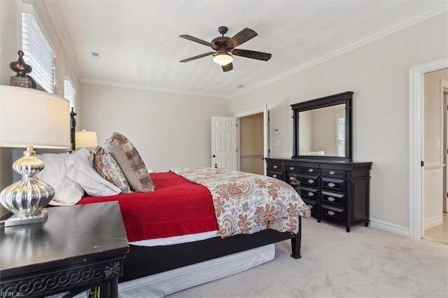 bedroom featuring ceiling fan, carpet, baseboards, and ornamental molding
