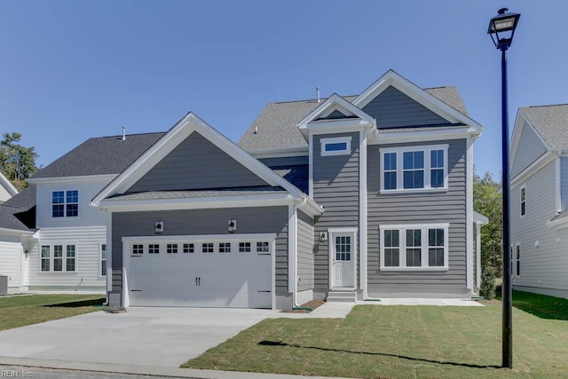 view of front of house featuring a garage, cooling unit, driveway, and a front lawn