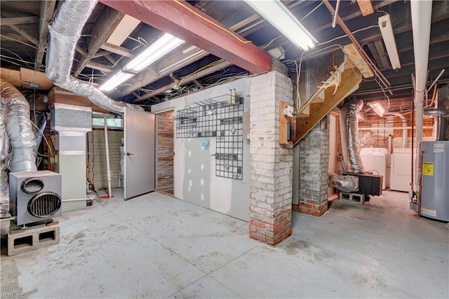 unfinished basement with separate washer and dryer and water heater