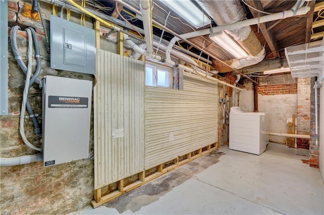 basement featuring electric panel and washer / clothes dryer