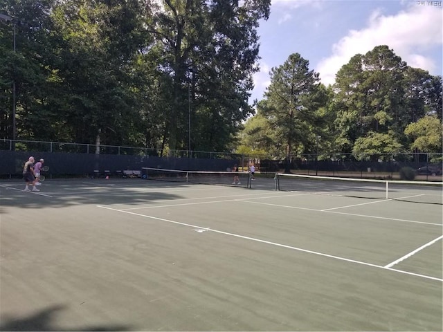 view of sport court with fence