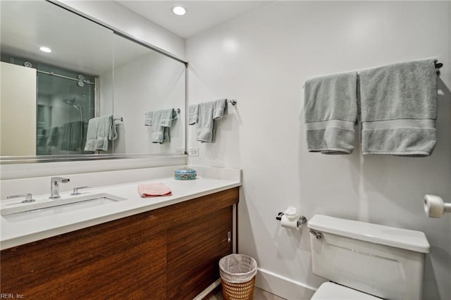 7320 Glenroie Ave Unit 2F, Norfolk, VA 23505 - bathroom with a stall shower, vanity, baseboards, toilet, and recessed lighting