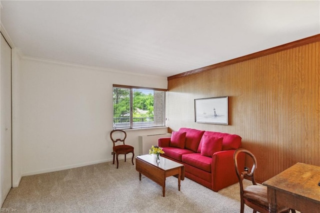 7320 Glenroie Ave Unit 2F, Norfolk, VA 23505 - living room with crown molding, wood walls, and light carpet