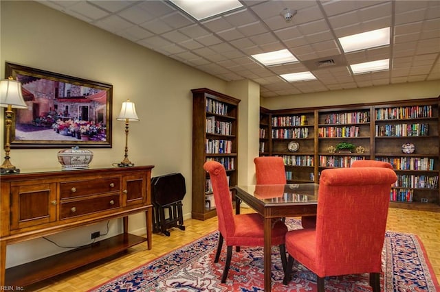 7320 Glenroie Ave Unit 2F, Norfolk, VA 23505 - living area featuring wall of books, a paneled ceiling, and visible vents