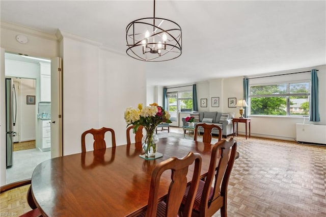 7320 Glenroie Ave Unit 2F, Norfolk, VA 23505 - dining space featuring baseboards, an inviting chandelier, and ornamental molding
