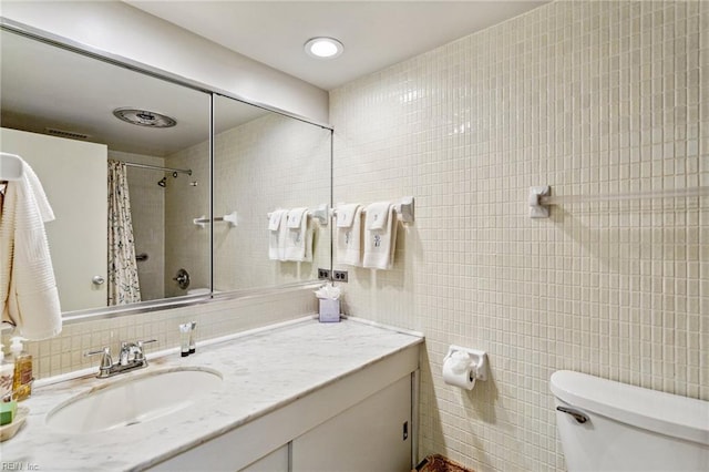 7320 Glenroie Ave Unit 2F, Norfolk, VA 23505 - bathroom featuring vanity, toilet, a shower with shower curtain, tile walls, and tasteful backsplash