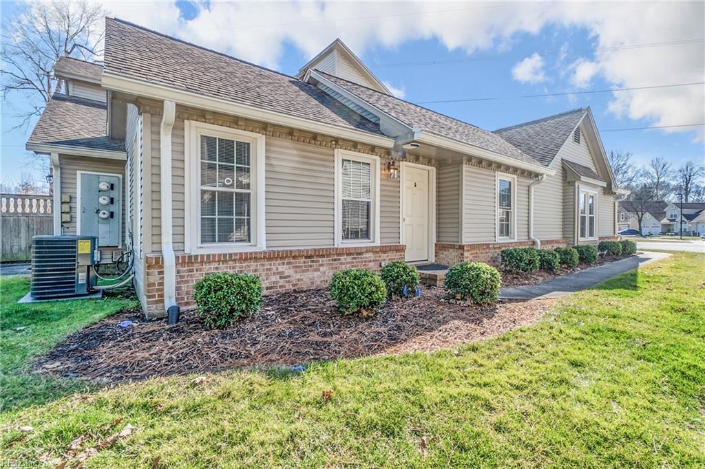 1306 Fairways Lookout Unit A, Chesapeake, VA 23320 - view of home's exterior featuring brick siding, central air condition unit, and a lawn