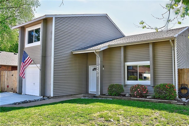 view of front of home featuring a garage, concrete driveway, a front yard, and fence