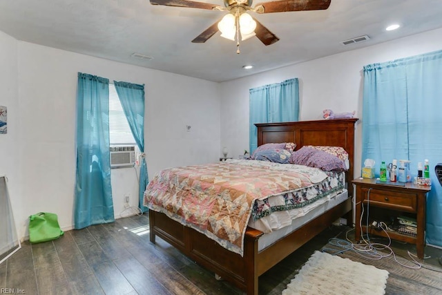 bedroom with visible vents, wood finished floors, and recessed lighting