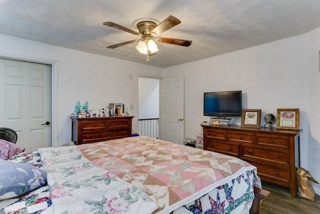 bedroom featuring dark wood-style flooring and ceiling fan