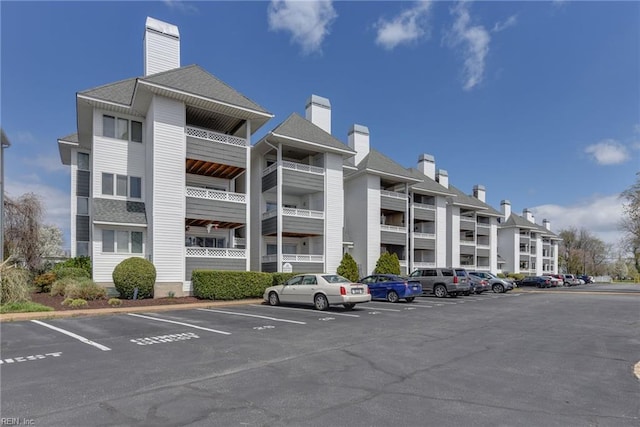 view of property featuring uncovered parking