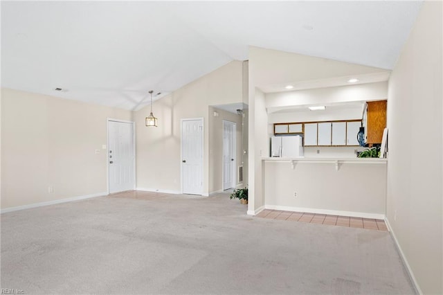 unfurnished living room featuring light carpet, baseboards, lofted ceiling, visible vents, and recessed lighting