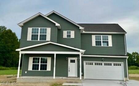 view of front of home with an attached garage, a porch, and driveway