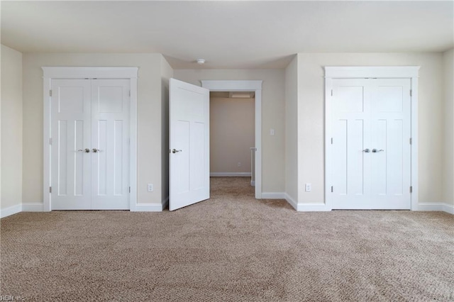 unfurnished bedroom with baseboards and carpet floors