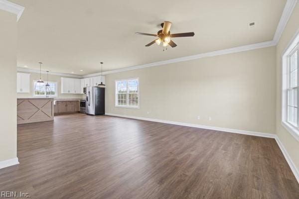 unfurnished living room with dark wood finished floors, ceiling fan, baseboards, and ornamental molding