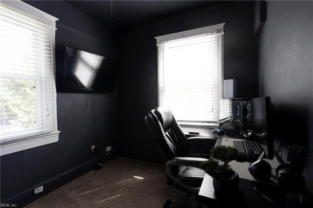carpeted home office featuring baseboards