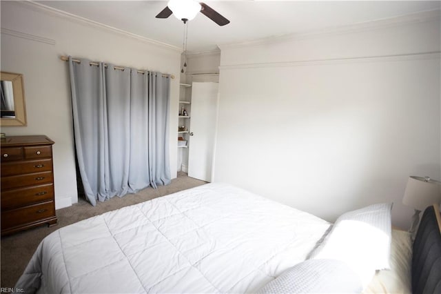 bedroom with a ceiling fan, ornamental molding, and carpet