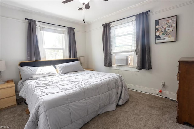 bedroom featuring cooling unit, baseboards, carpet, a ceiling fan, and crown molding