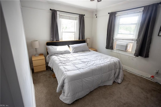 bedroom with carpet floors, baseboards, and ornamental molding