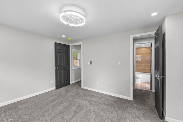 unfurnished bedroom with recessed lighting, baseboards, and carpet
