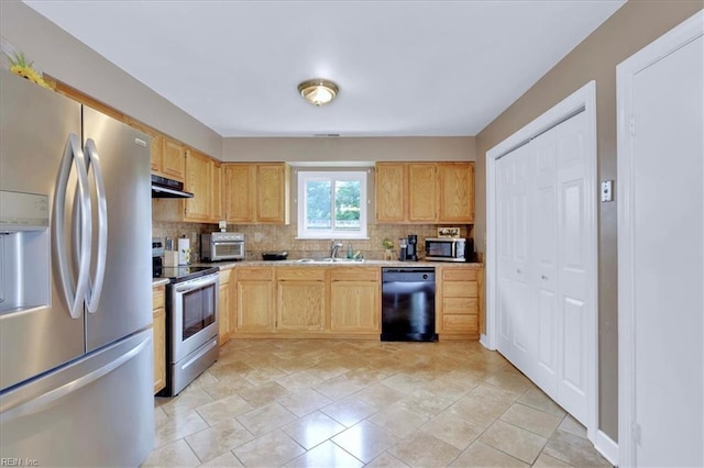 4904 Aquarius Ct, Virginia Beach, VA 23464 - kitchen with appliances with stainless steel finishes, light countertops, a sink, decorative backsplash, and light brown cabinets