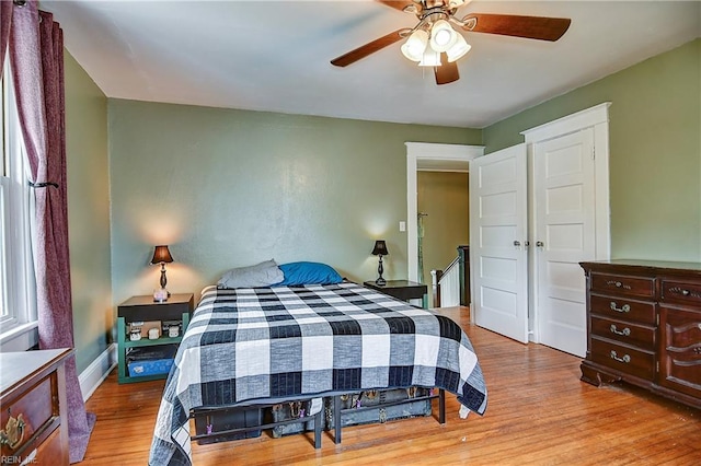 bedroom with wood finished floors and ceiling fan