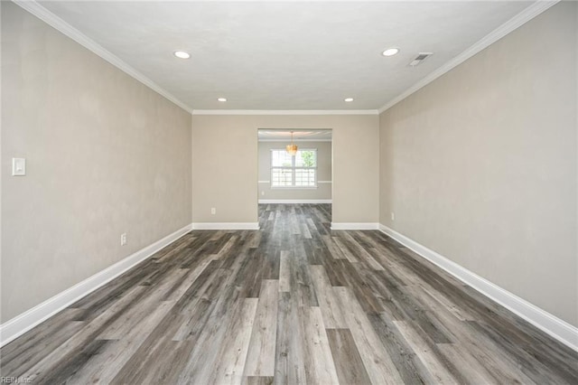 empty room featuring crown molding, dark wood finished floors, baseboards, visible vents, and recessed lighting
