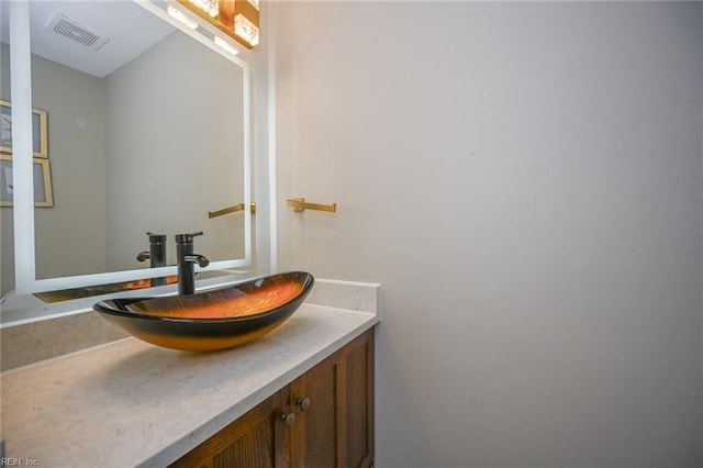 bathroom featuring visible vents and vanity